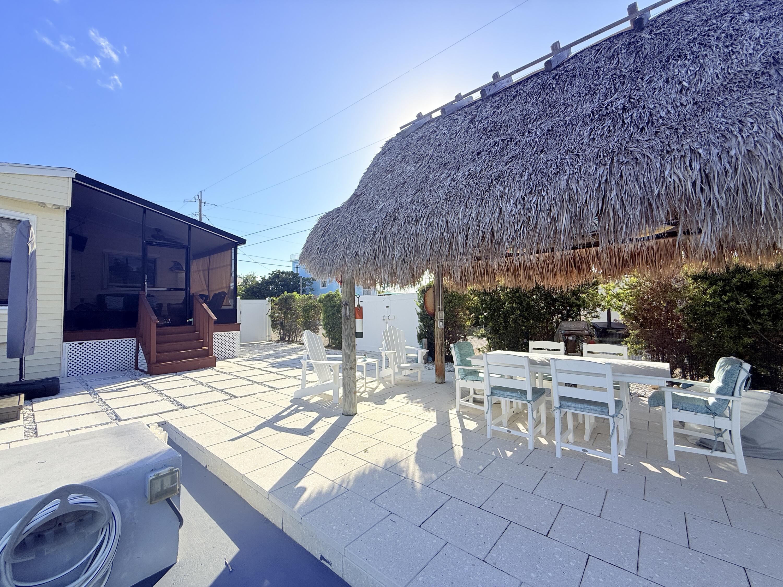 723 Boyd Drive Key Largo, FL 33037 - Photo 47 of 56 a view of an outdoor dining space with a patio