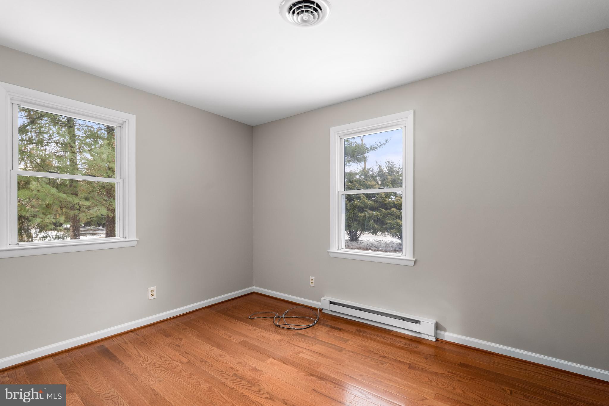 900 New Bridge Road Rising Sun, MD 21911 - Photo 15 of 29 an empty room with wooden floor and windows