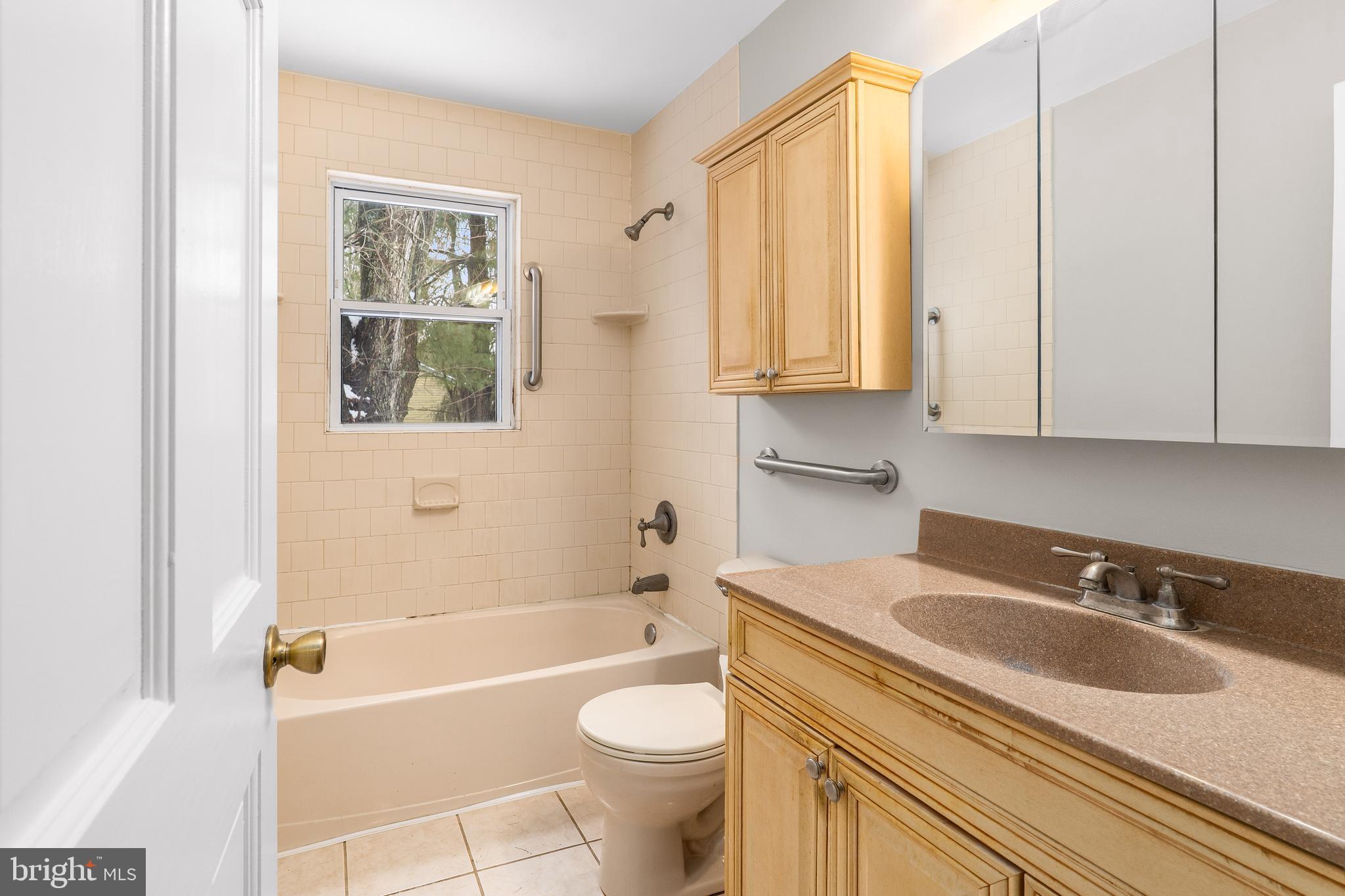 900 New Bridge Road Rising Sun, MD 21911 - Photo 18 of 29 a bathroom with a sink a toilet and a bathtub