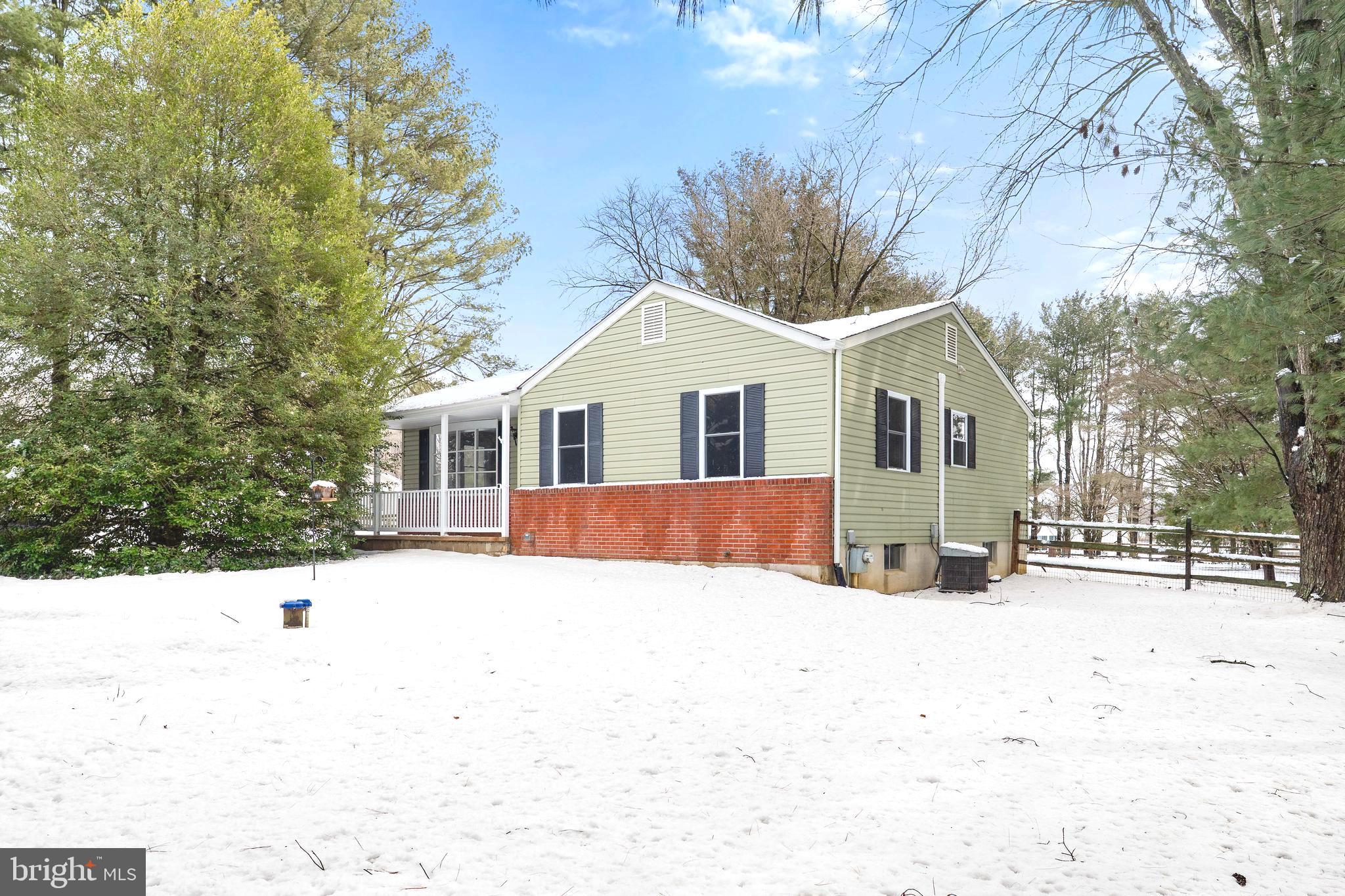 900 New Bridge Road Rising Sun, MD 21911 - Photo 2 of 29 a white house with a outdoor space covered with snow in the background