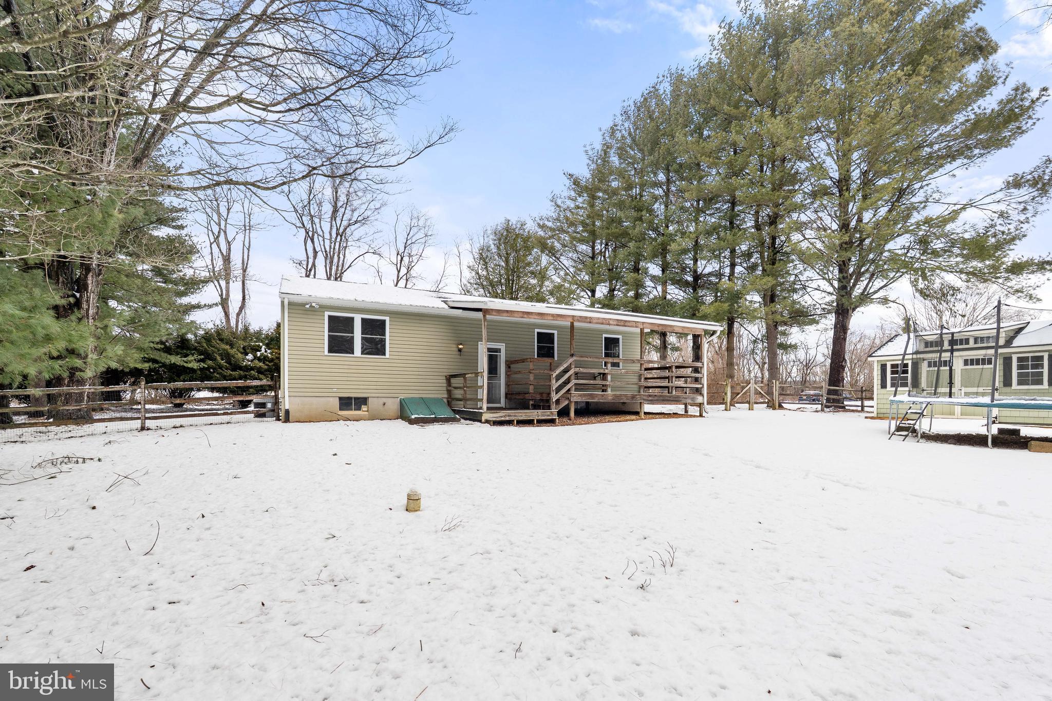 900 New Bridge Road Rising Sun, MD 21911 - Photo 24 of 29 a front view of a house with a yard covered in snow