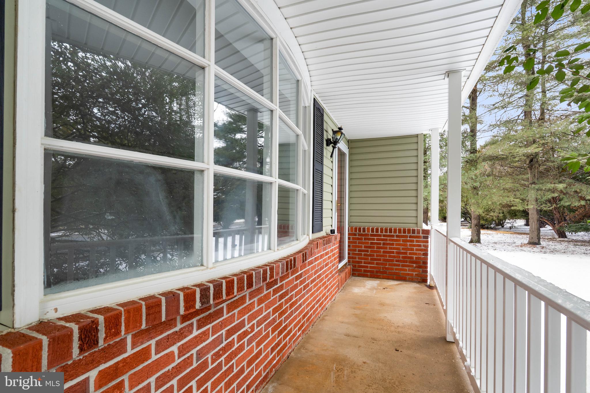 900 New Bridge Road Rising Sun, MD 21911 - Photo 4 of 29 a porch with wooden floor