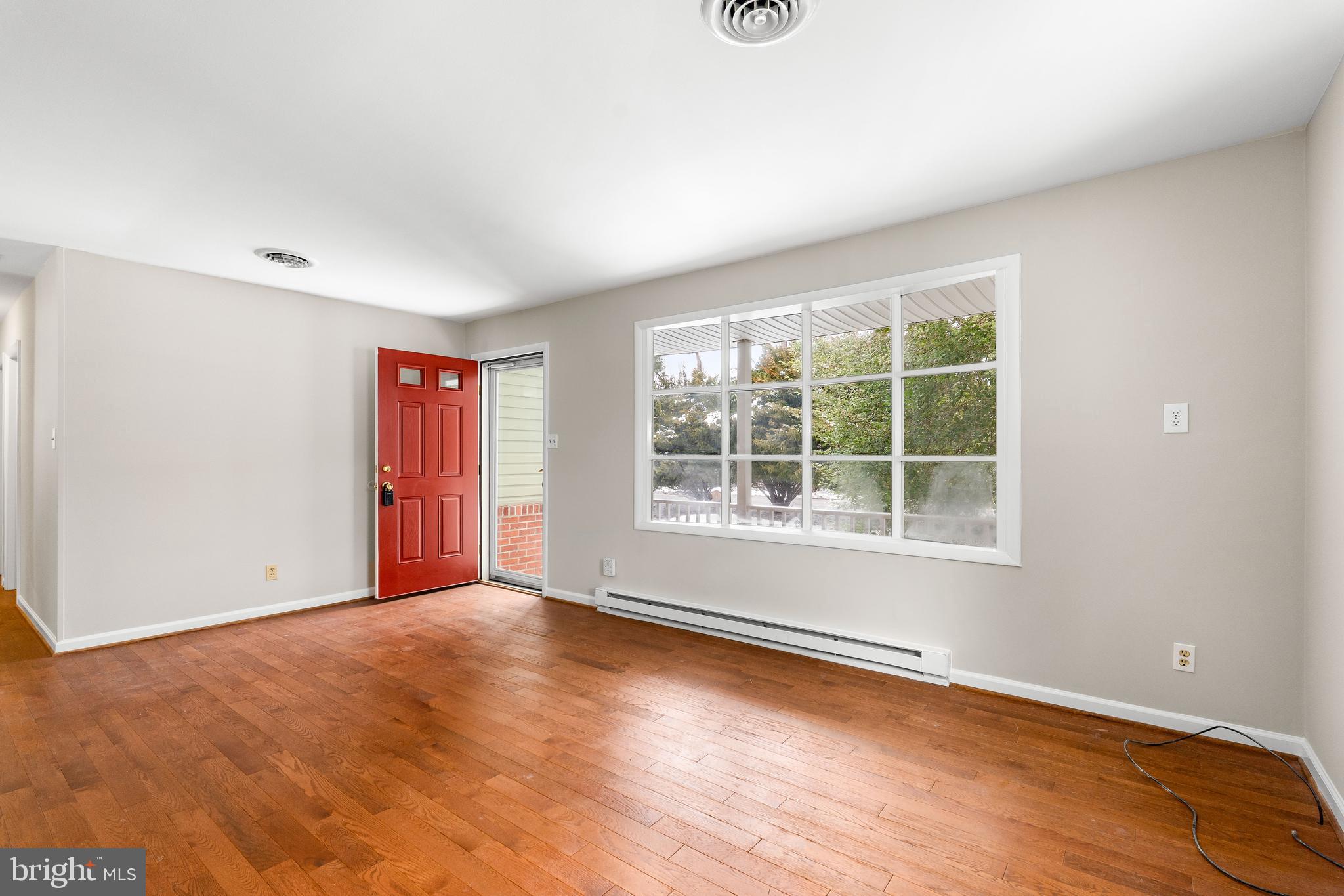 900 New Bridge Road Rising Sun, MD 21911 - Photo 5 of 29 an empty room with wooden floor and windows