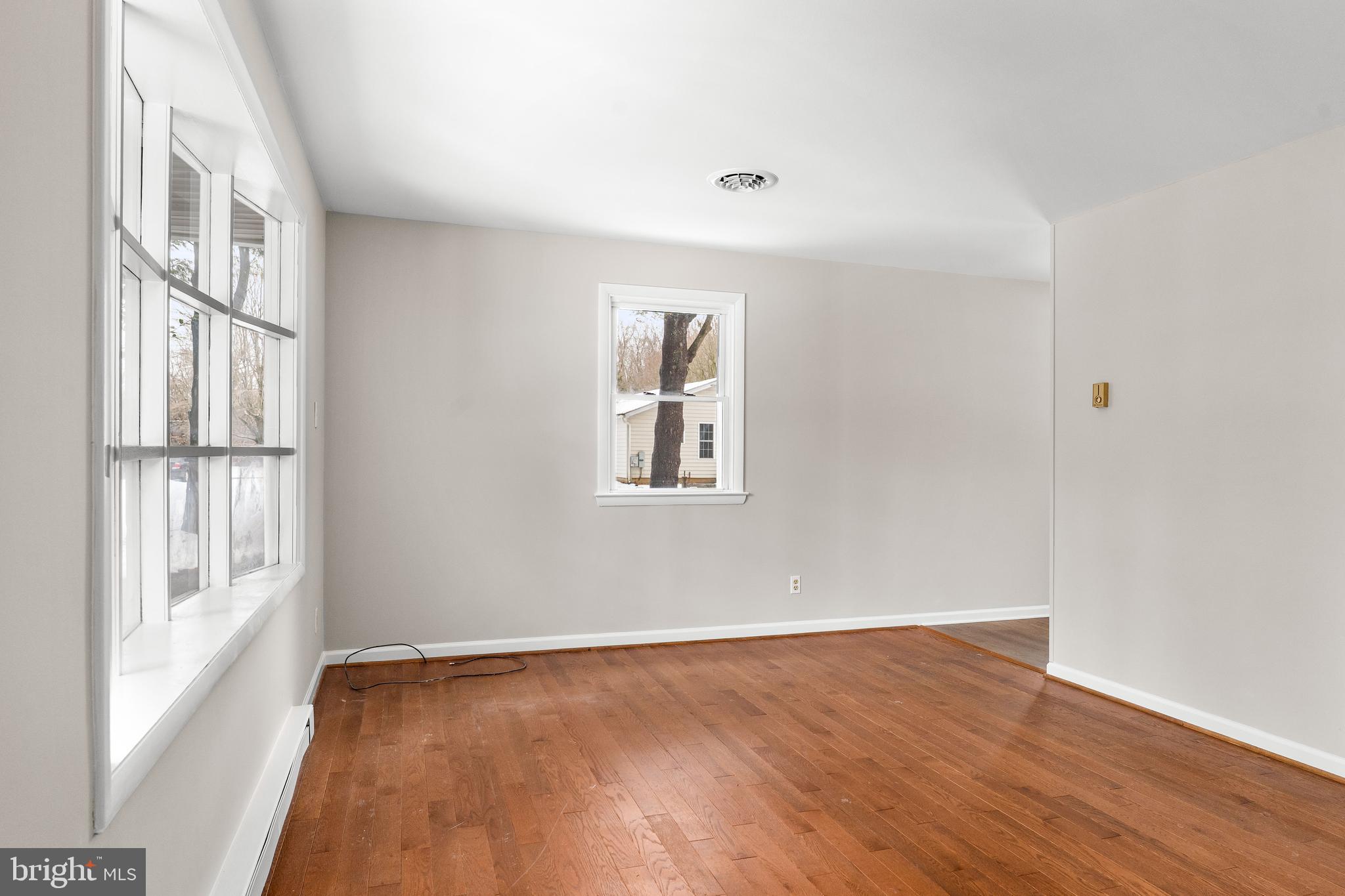 900 New Bridge Road Rising Sun, MD 21911 - Photo 7 of 29 a view of an empty room with wooden floor and a window