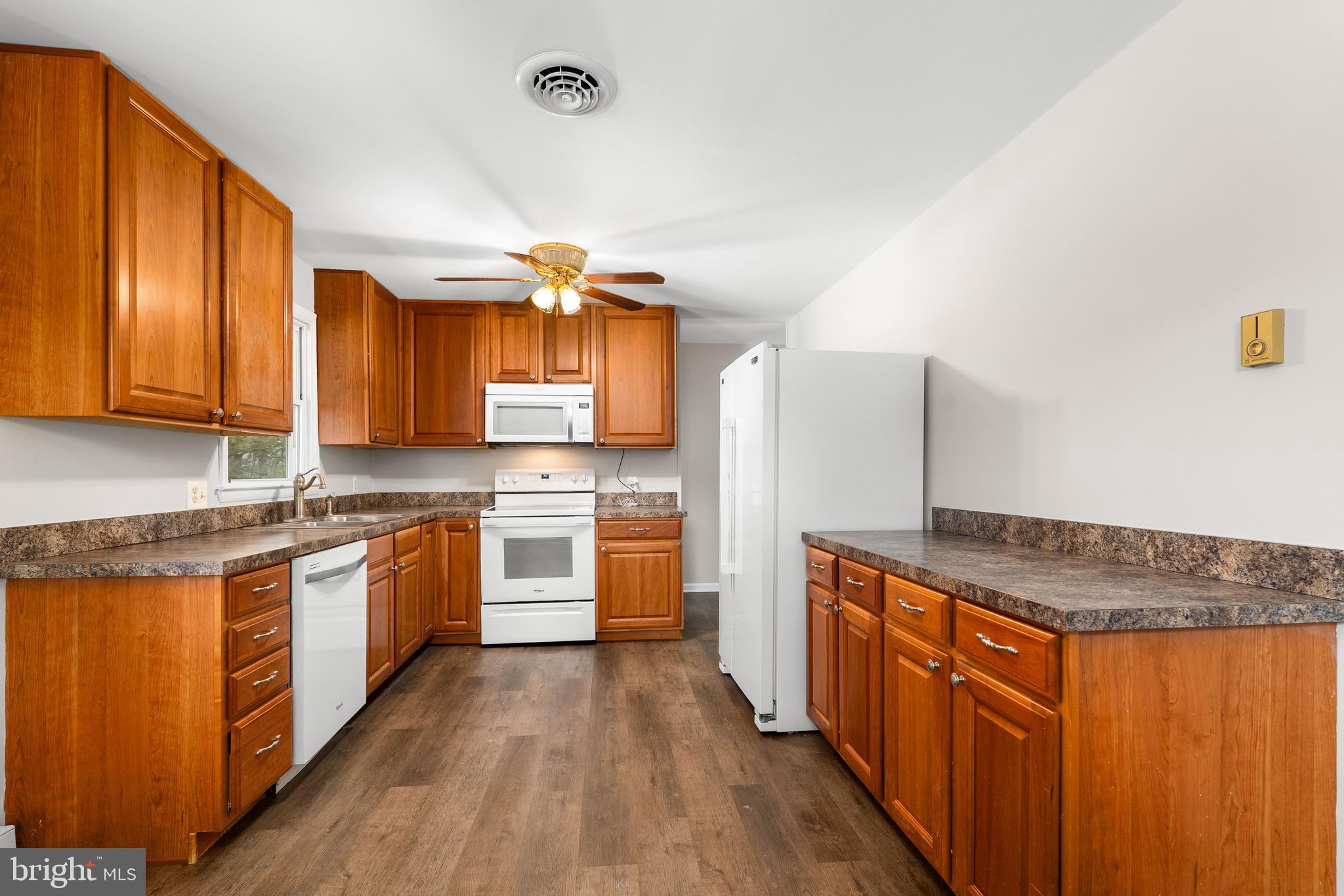 900 New Bridge Road Rising Sun, MD 21911 - Photo 8 of 29 a kitchen with stainless steel appliances granite countertop a stove a sink dishwasher and a refrigerator