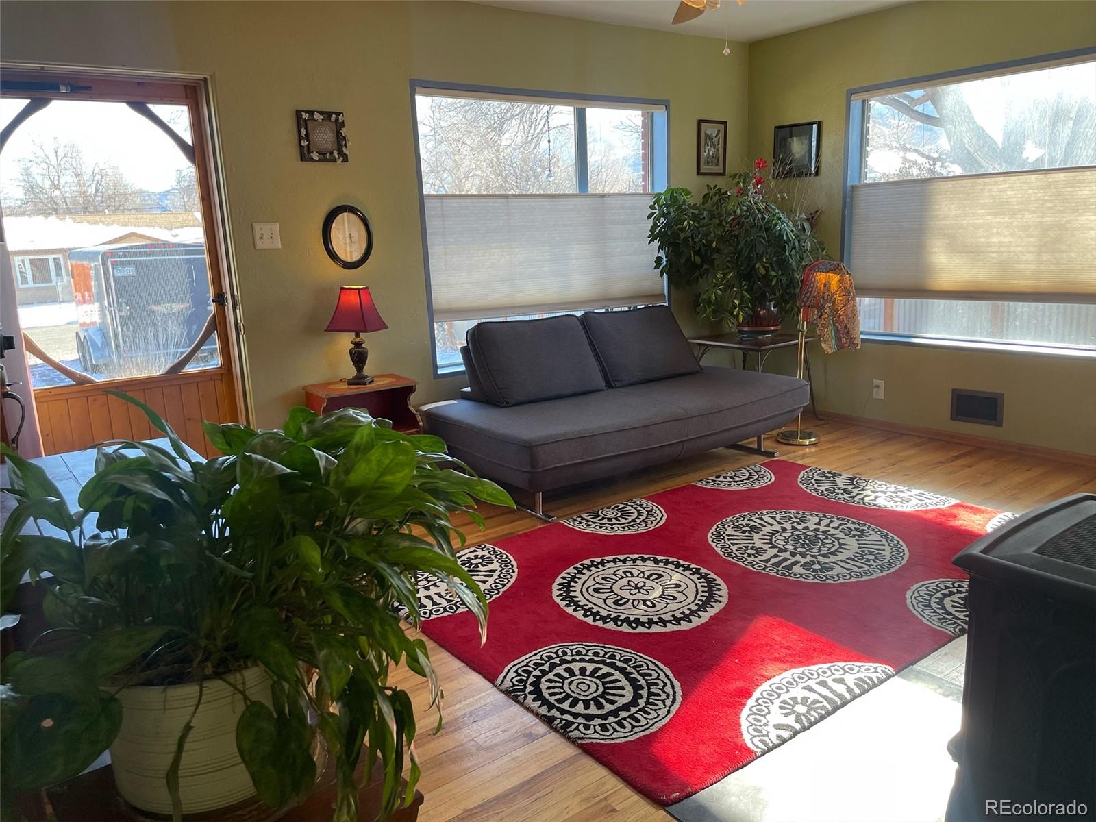 1328 I Street Salida, CO 81201 - Photo 13 of 24 a living room with furniture and a floor to ceiling window