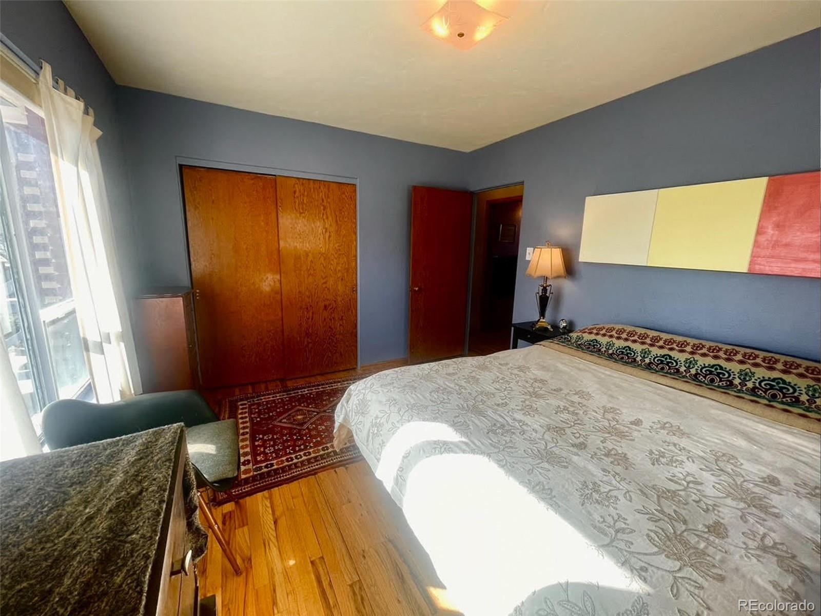 1328 I Street Salida, CO 81201 - Photo 16 of 23 a spacious bedroom with a bed and a window