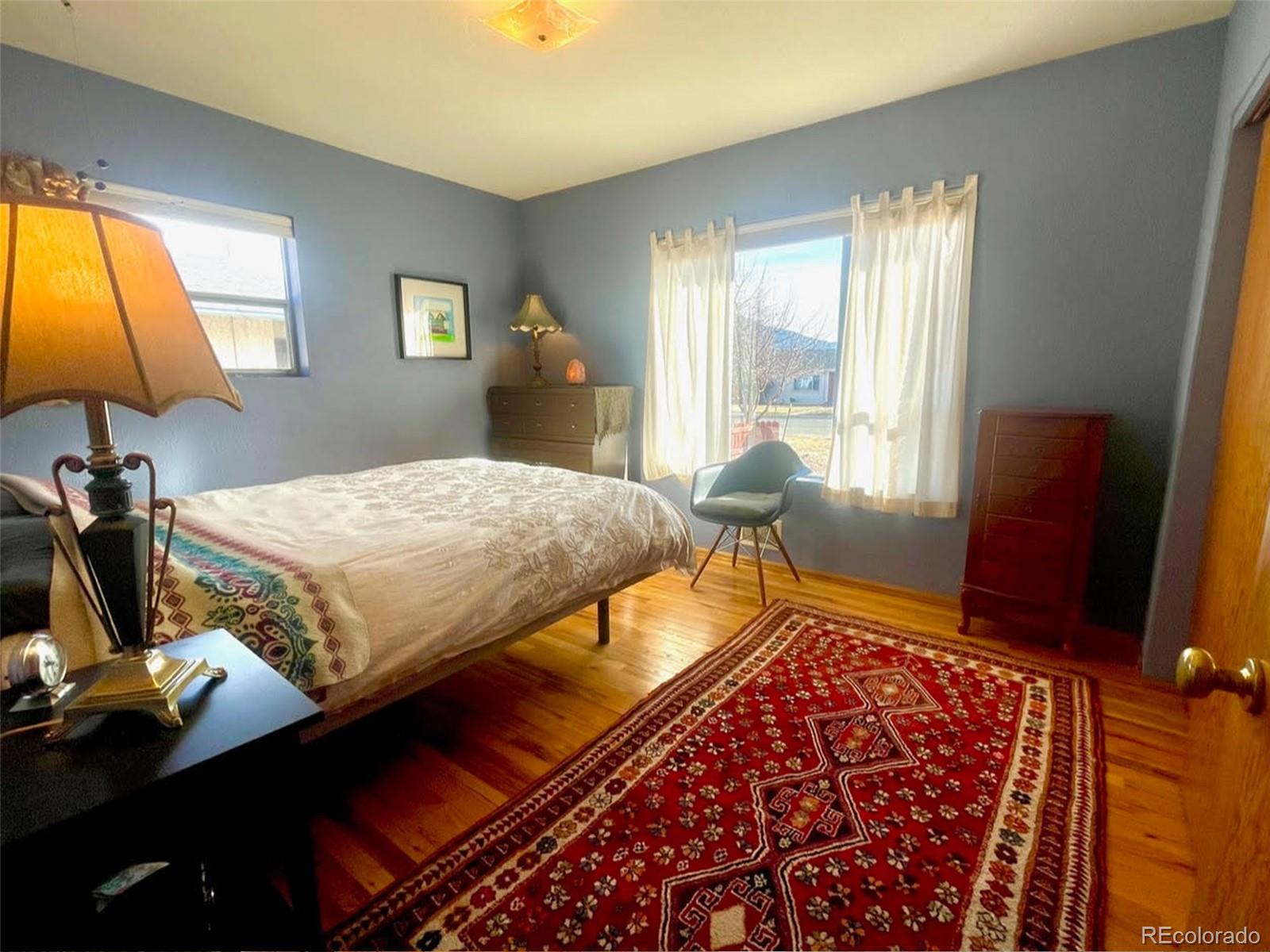 1328 I Street Salida, CO 81201 - Photo 16 of 24 a bedroom with a bed and two windows