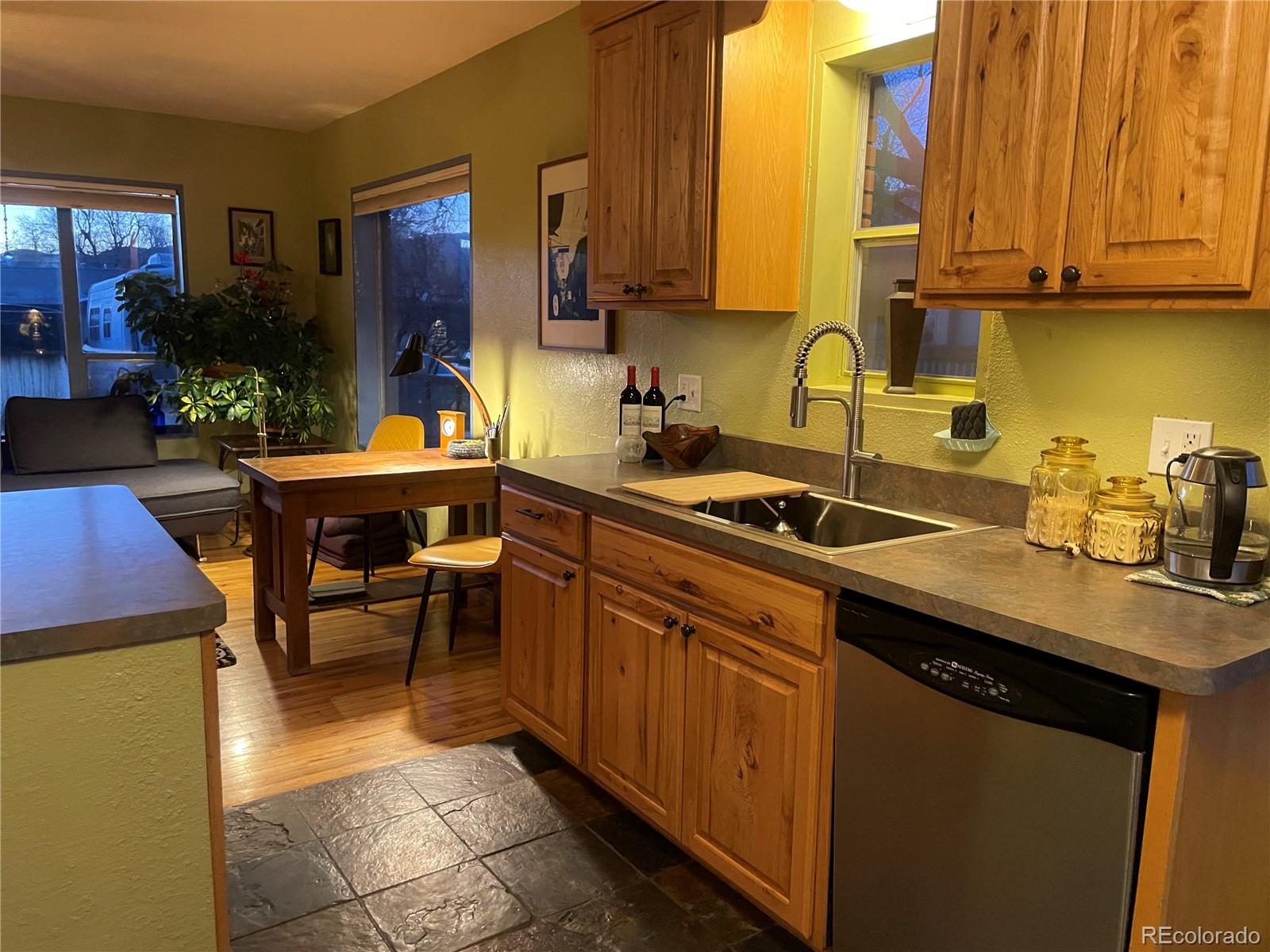 1328 I Street Salida, CO 81201 - Photo 24 of 24 a kitchen with stainless steel appliances granite countertop a sink stove and cabinets