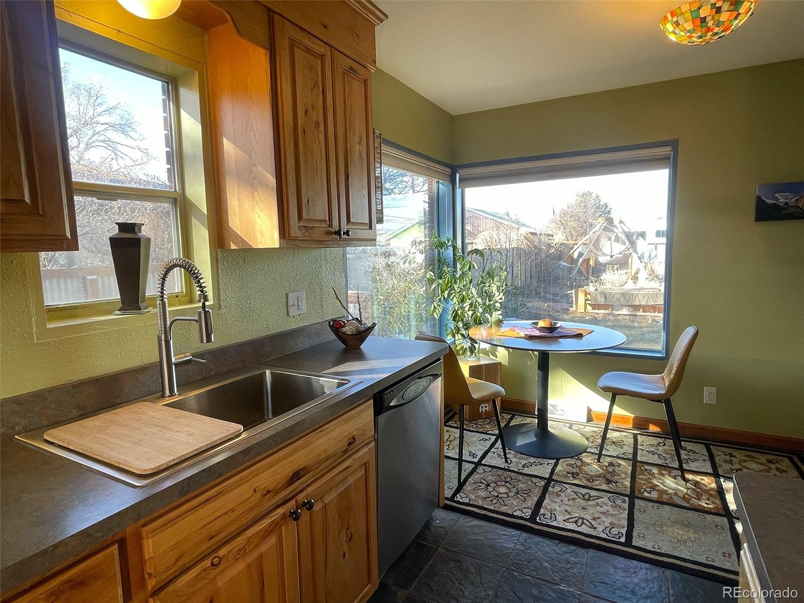 1328 I Street Salida, CO 81201 - Photo 4 of 24 a kitchen that has a sink and a large window in it