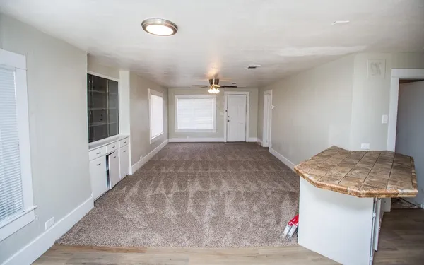 a view of a kitchen with a sink and a window