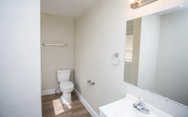 a white bath tub sitting next to a toilet