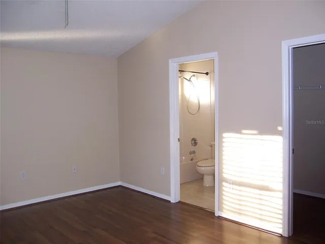 a view of wooden floor in an empty room