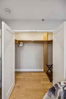 a bedroom with a bed and a dresser