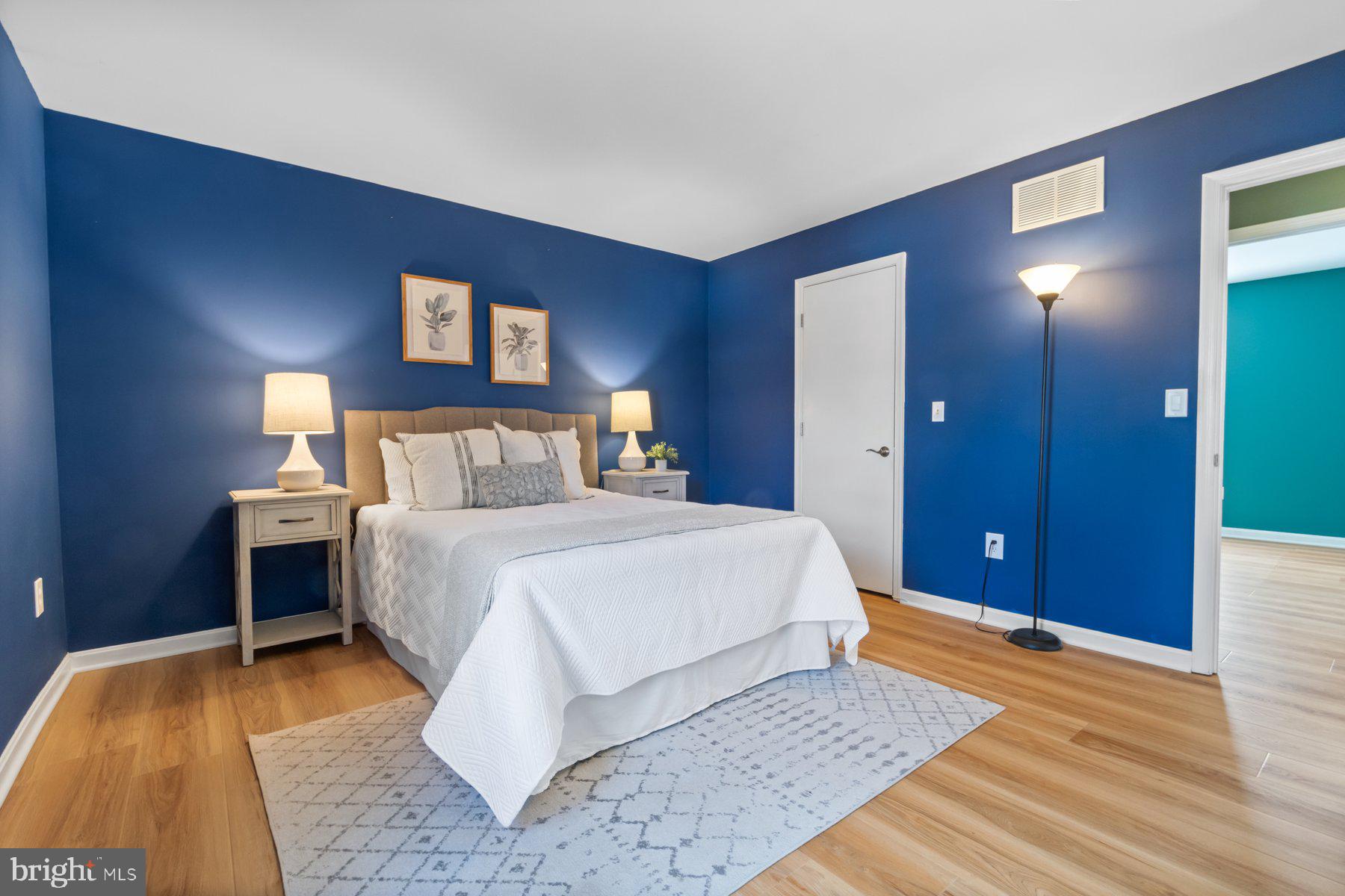 1512 Pullman Drive Severn, MD 21144 - Photo 14 of 34 a bedroom with a bed and a lamps with the dresser