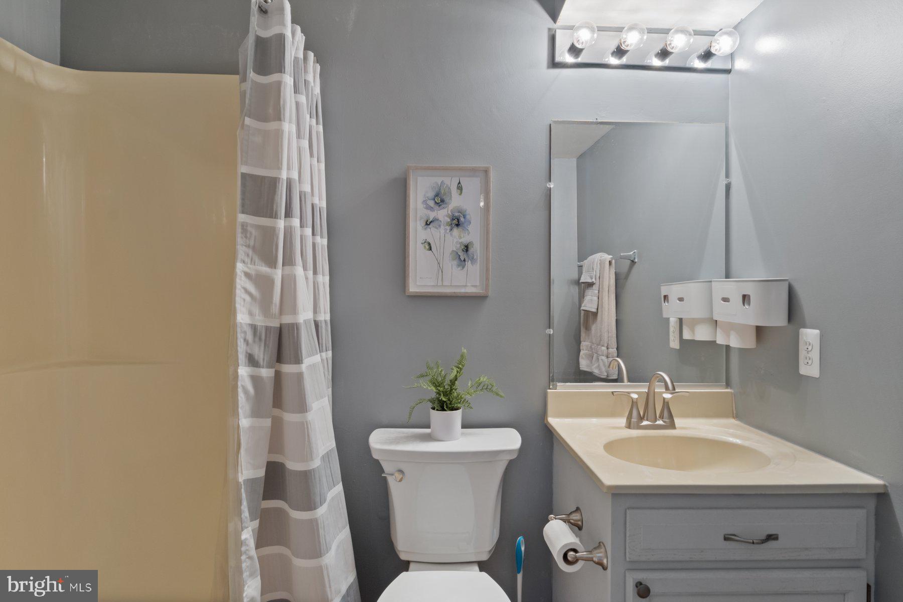 1512 Pullman Drive Severn, MD 21144 - Photo 15 of 34 a bathroom with a sink mirror and toilet