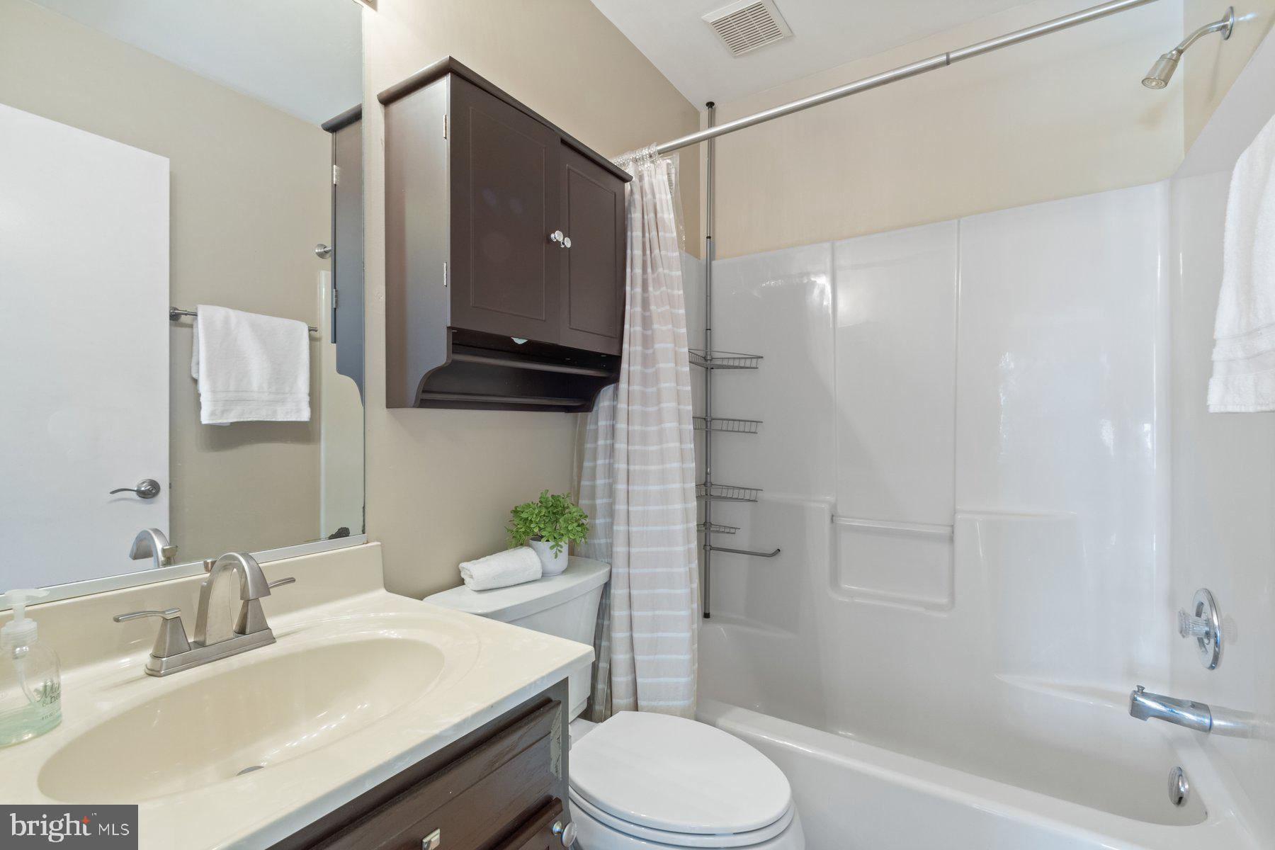 1512 Pullman Drive Severn, MD 21144 - Photo 19 of 34 a bathroom with a sink toilet and shower