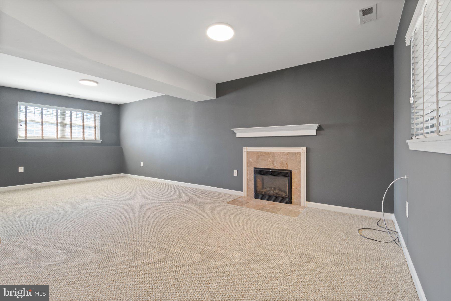 1512 Pullman Drive Severn, MD 21144 - Photo 20 of 34 a big room with windows and fireplace
