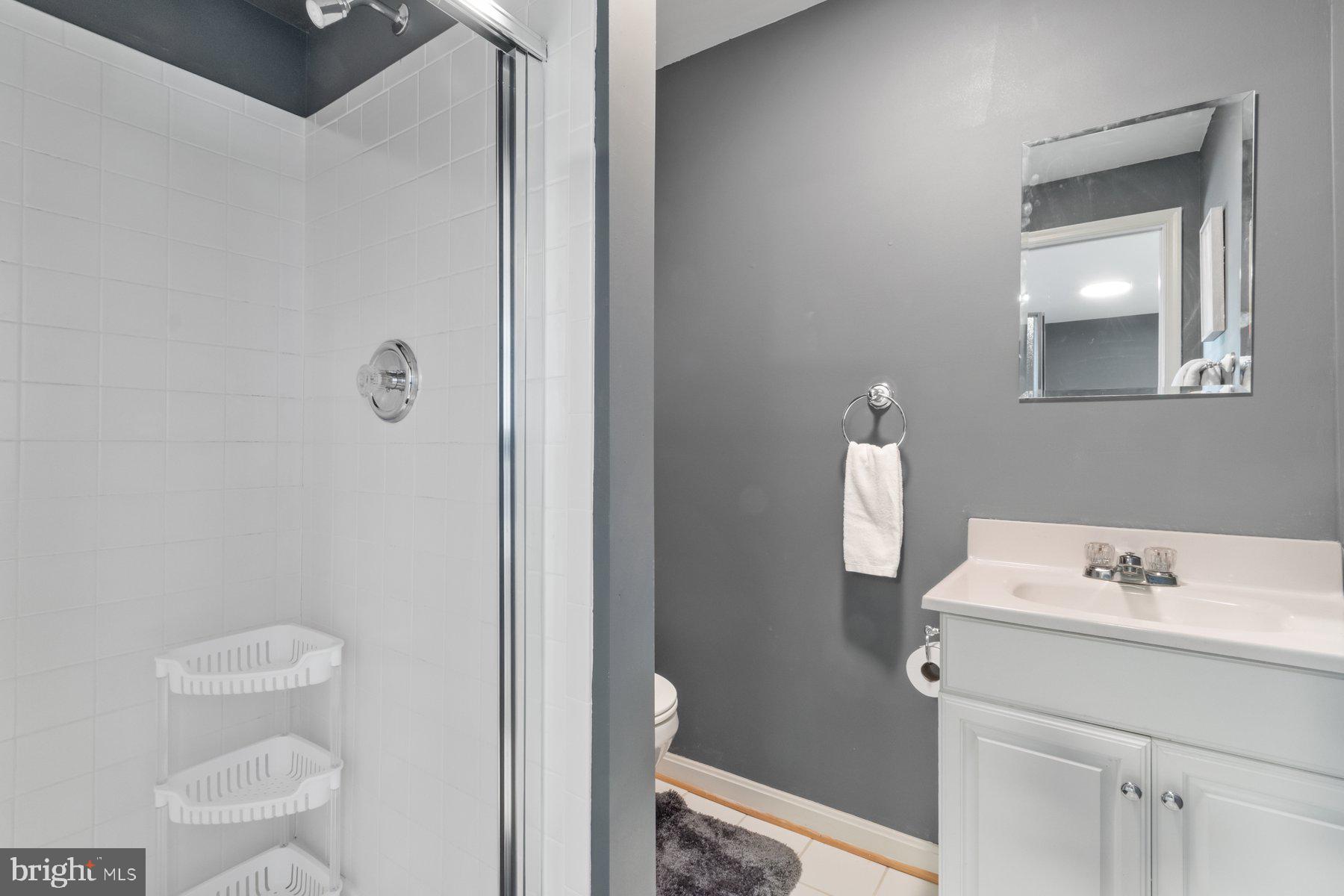 1512 Pullman Drive Severn, MD 21144 - Photo 22 of 34 a bathroom with a sink a toilet and a mirror