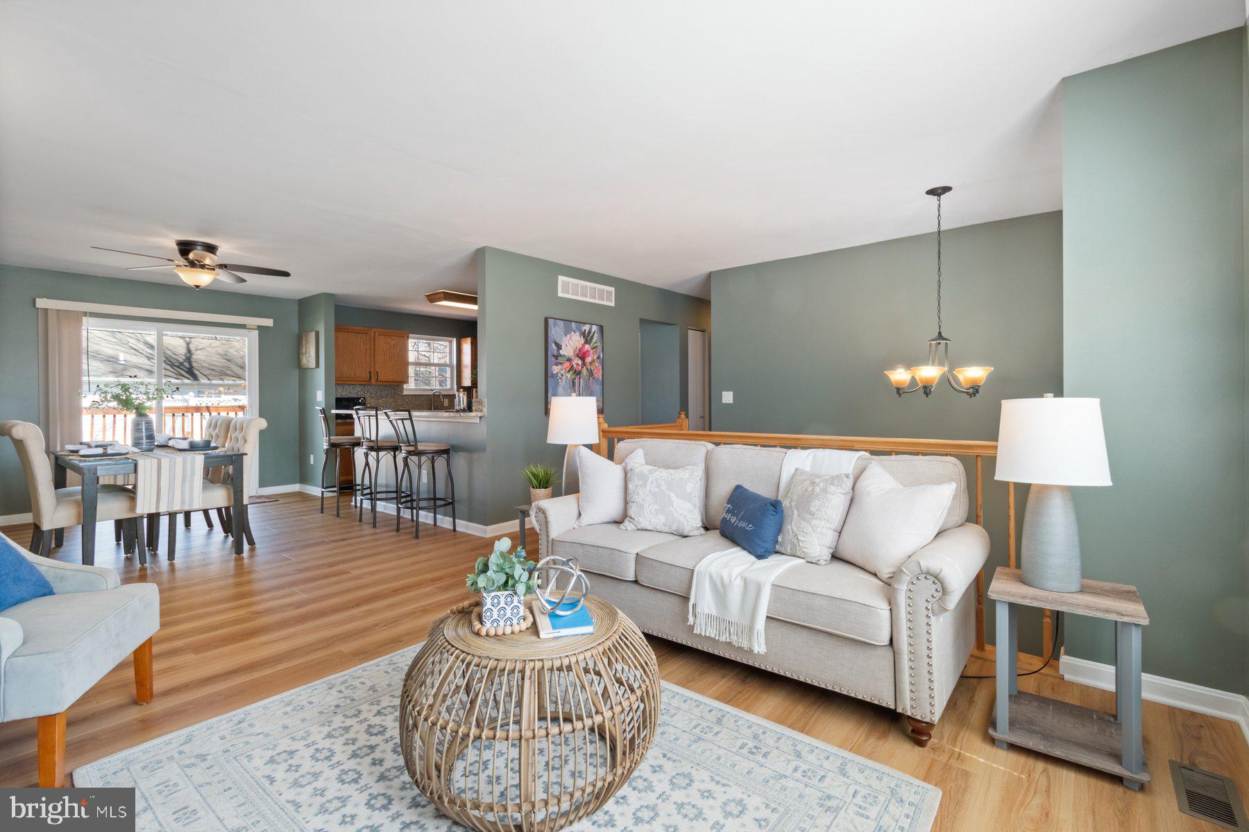 1512 Pullman Drive Severn, MD 21144 - Photo 3 of 34 a living room with furniture a lamp and a table
