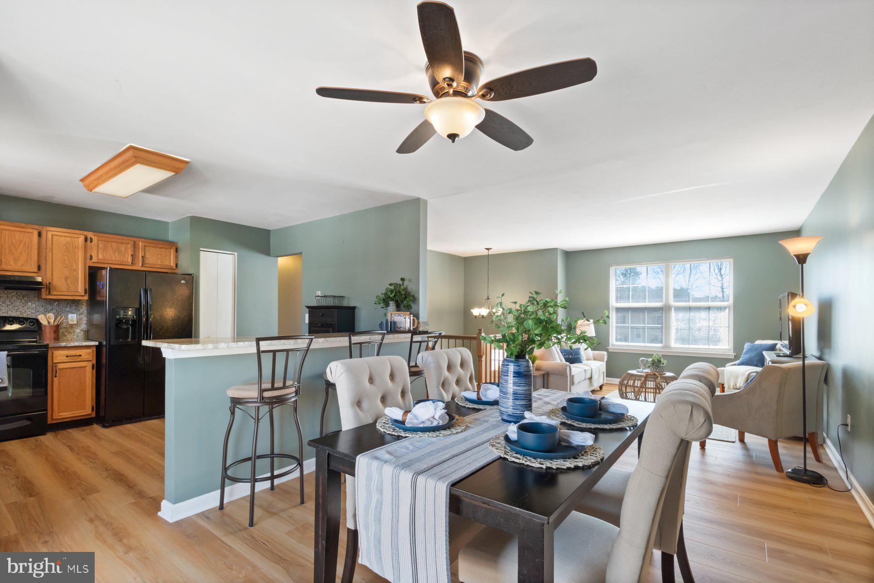 1512 Pullman Drive Severn, MD 21144 - Photo 6 of 34 a view of a dining room with furniture and wooden floor