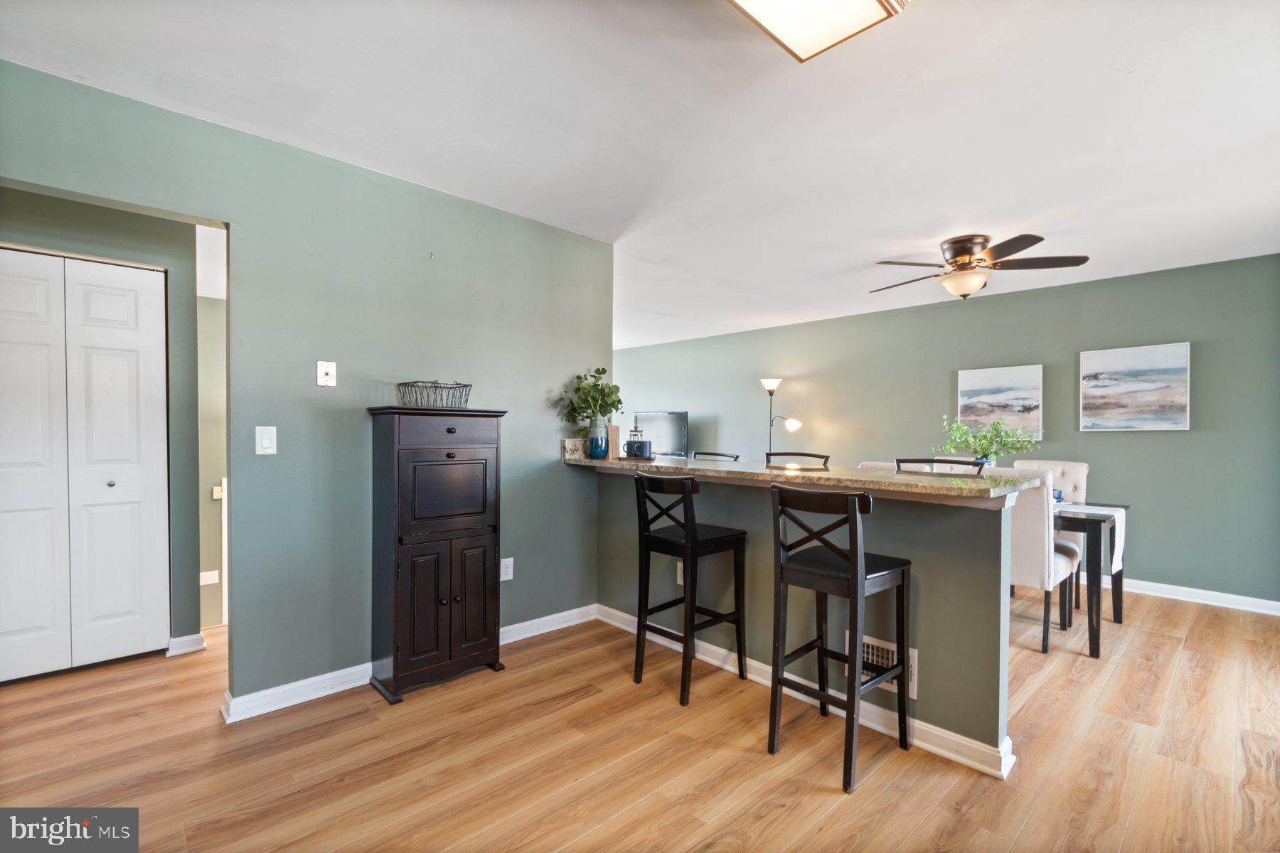 1512 Pullman Drive Severn, MD 21144 - Photo 9 of 34 a view of a dining room with furniture and wooden floor