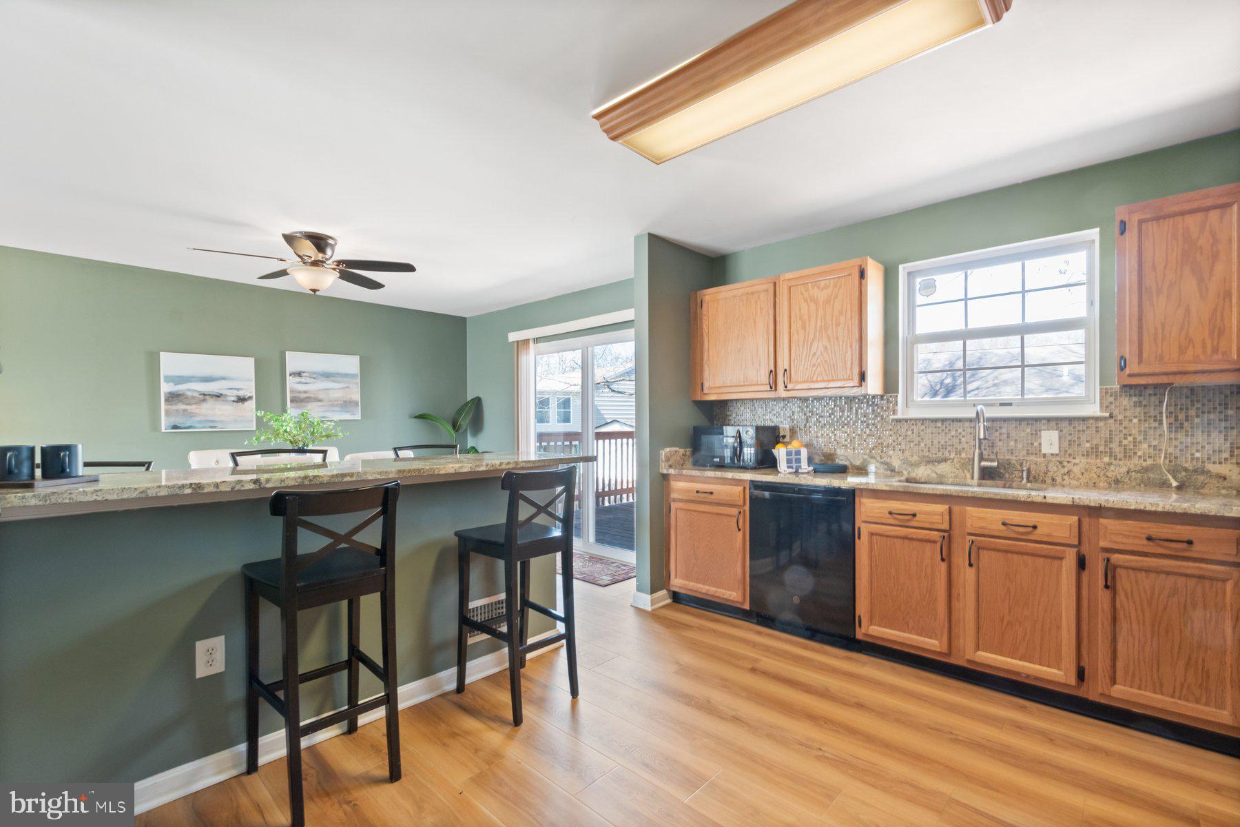 1512 Pullman Drive Severn, MD 21144 - Photo 10 of 34 a kitchen with a sink cabinets and dining table chair