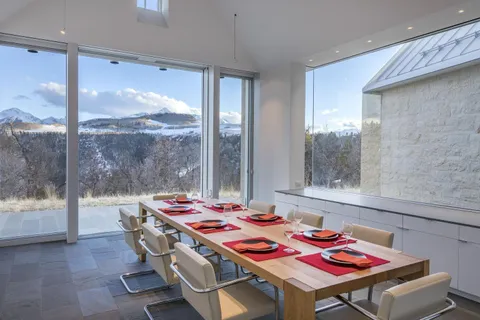 a table that has a table and chairs in it