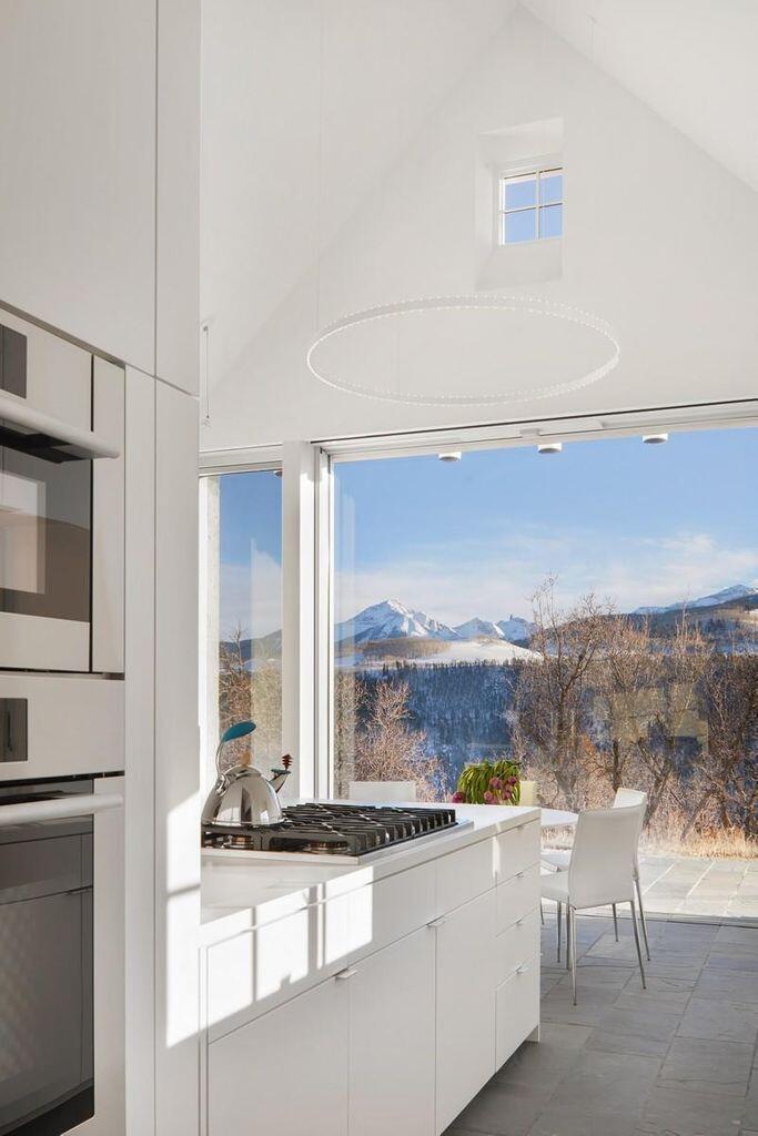 1068 Wilson Way Telluride, CO 81435 - Photo 13 of 40 a large white kitchen with a sink and a large window