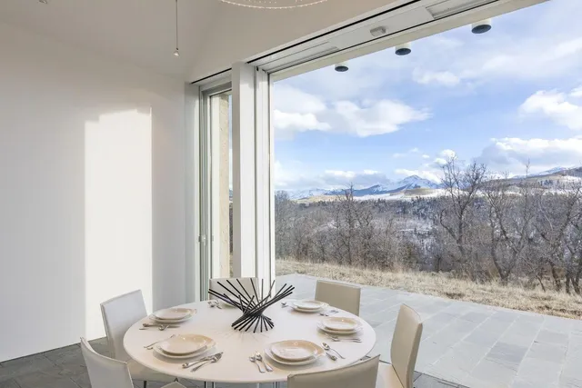 a view of a dining room with furniture window and outside view