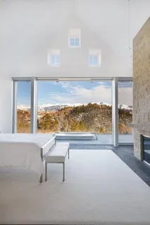a view of a living room and floor to ceiling window