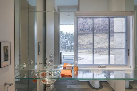 a dining table sitting next to a window