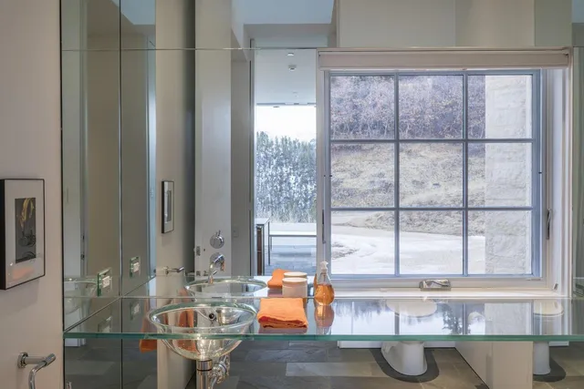 a dining table sitting next to a window