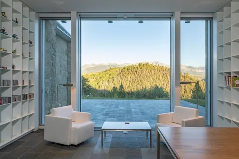 a living room with couch and a large window