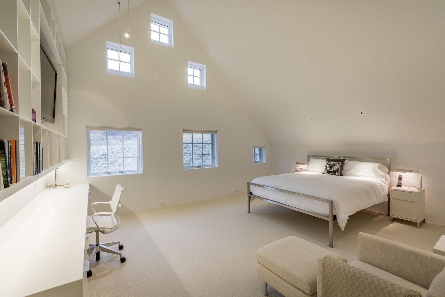 1068 Wilson Way Telluride, CO 81435 - Photo 26 of 40 a bedroom with furniture and a window