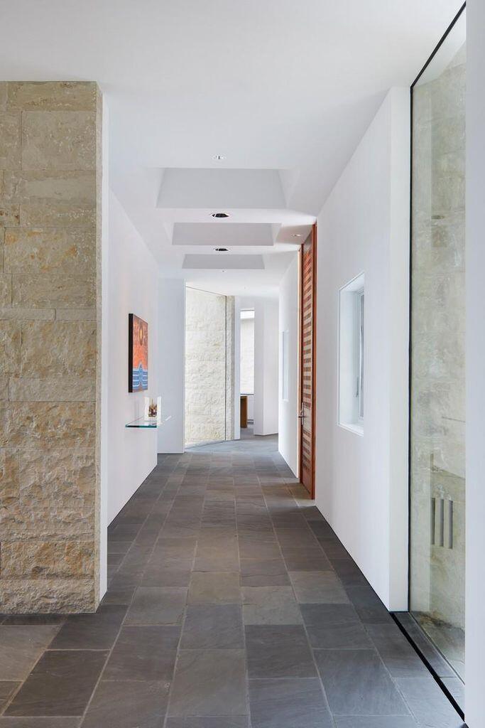 1068 Wilson Way Telluride, CO 81435 - Photo 28 of 40 a view of a hallway with wooden shelves
