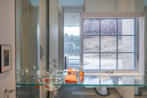 a bathroom with a shower and a sink