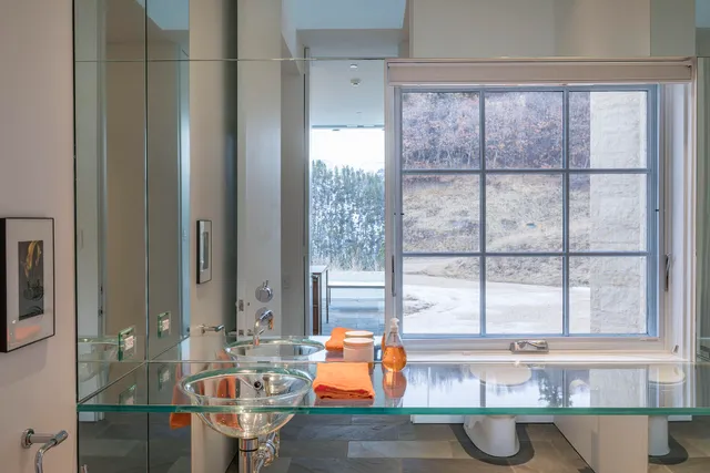 a bathroom with a shower and a sink