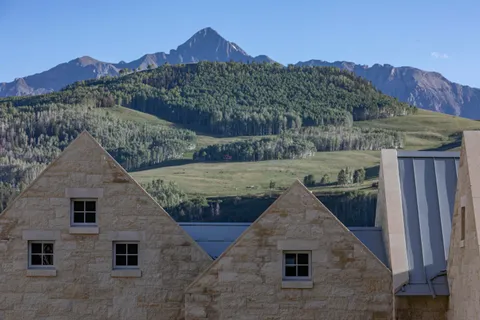a view of a lake in middle of the forest