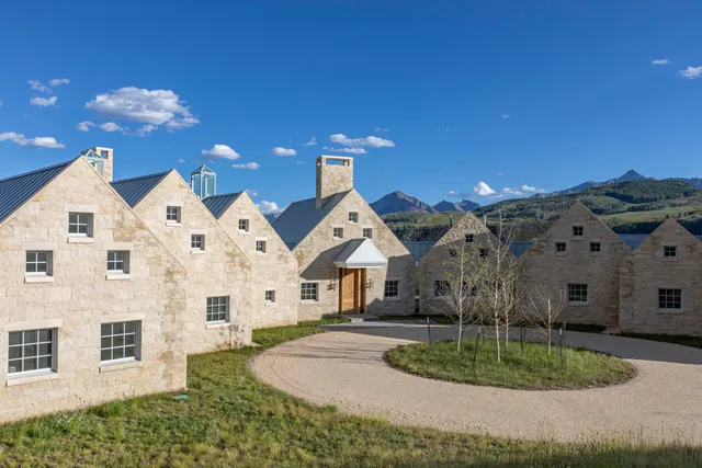 a aerial view of a house with a yard