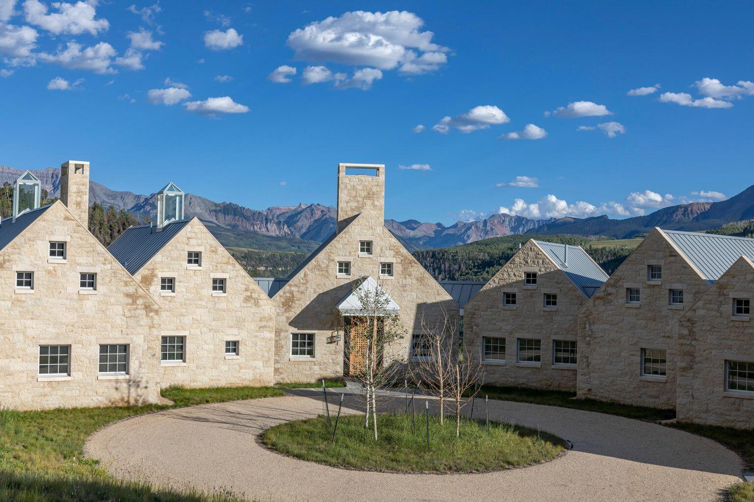 1068 Wilson Way Telluride, CO 81435 - Photo 5 of 40 a front view of a house with a yard and outdoor seating