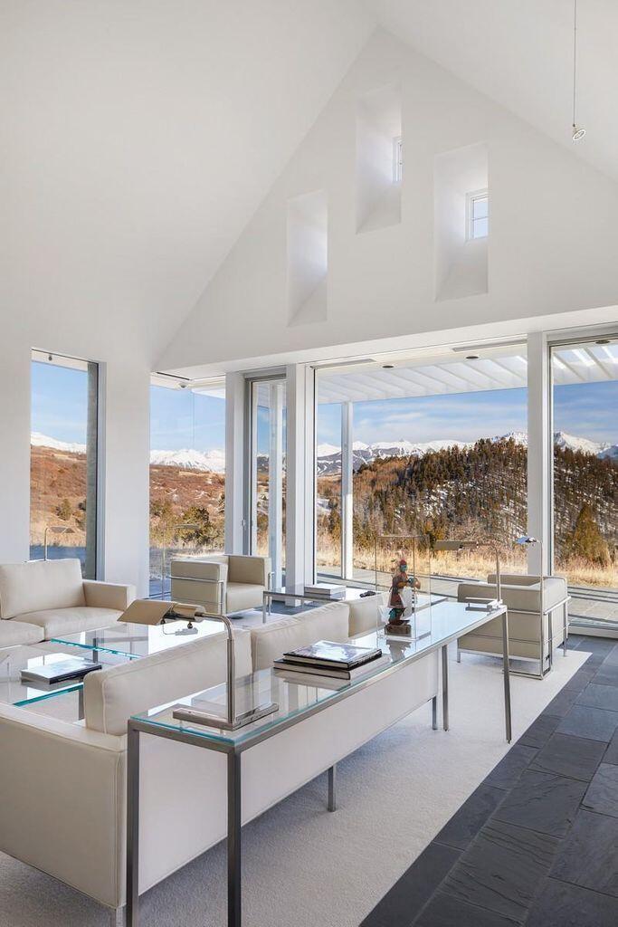 1068 Wilson Way Telluride, CO 81435 - Photo 7 of 40 a living room with furniture and a large window