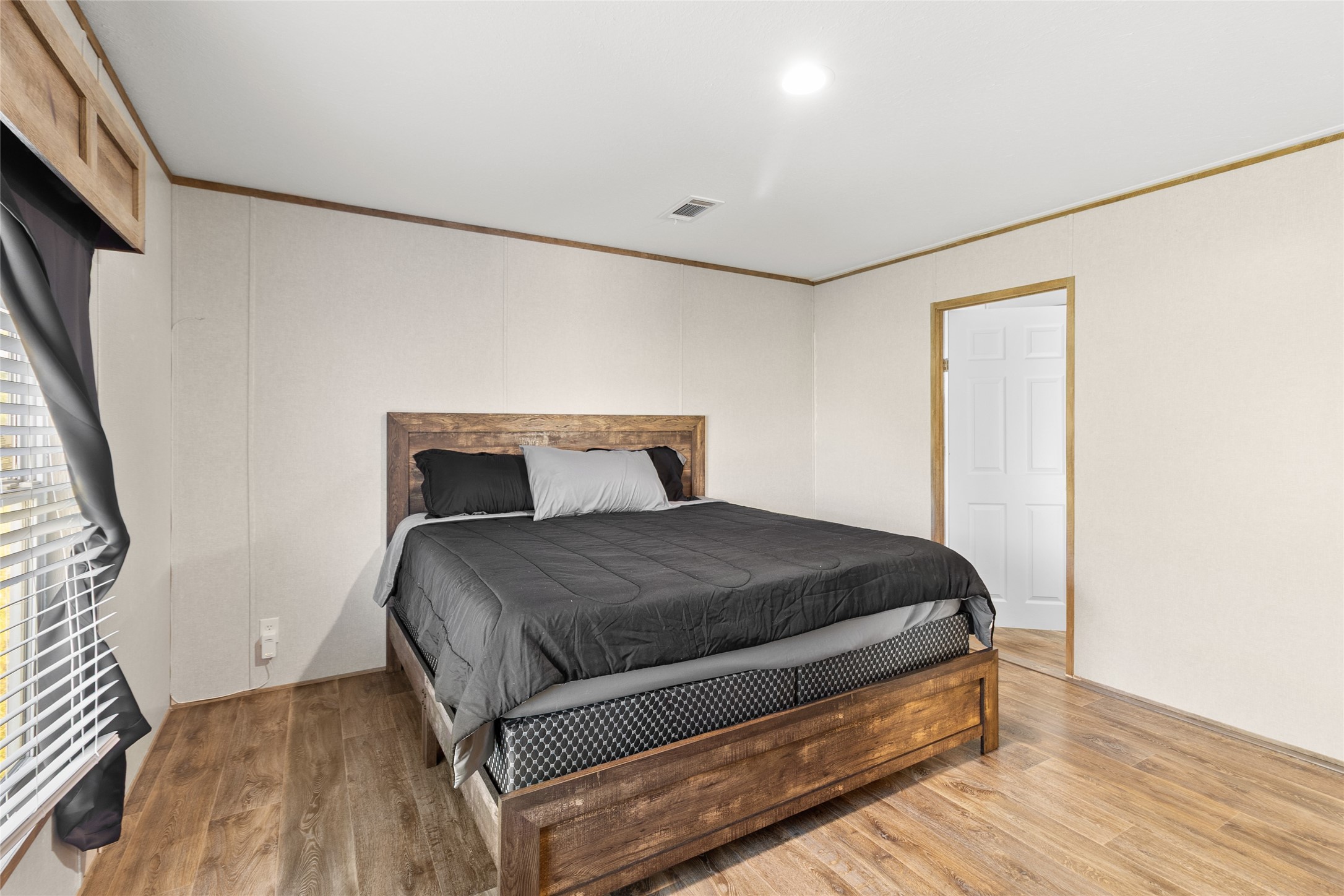 43 Ironwood Road Victoria, TX 77904 - Photo 16 of 21 a bedroom with a bed and wooden floor