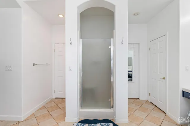 a bathroom with a sink double vanity and a mirror