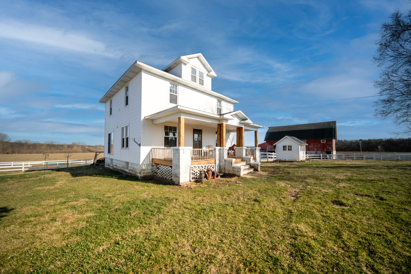 1801 Lee Center Road Amboy, IL 61310 - Photo 18 of 45 a front view of a house with a yard