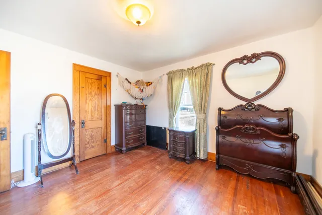 a living room with furniture and a mirror