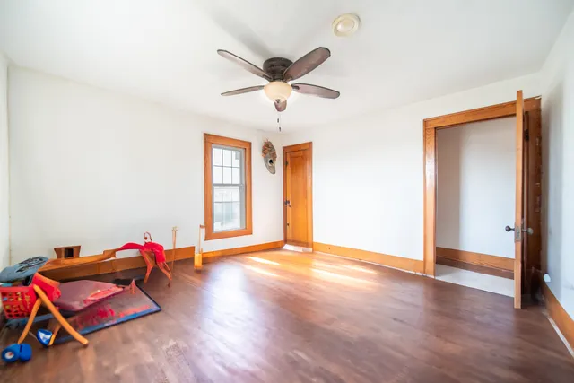 a view of a house with pool and sitting area