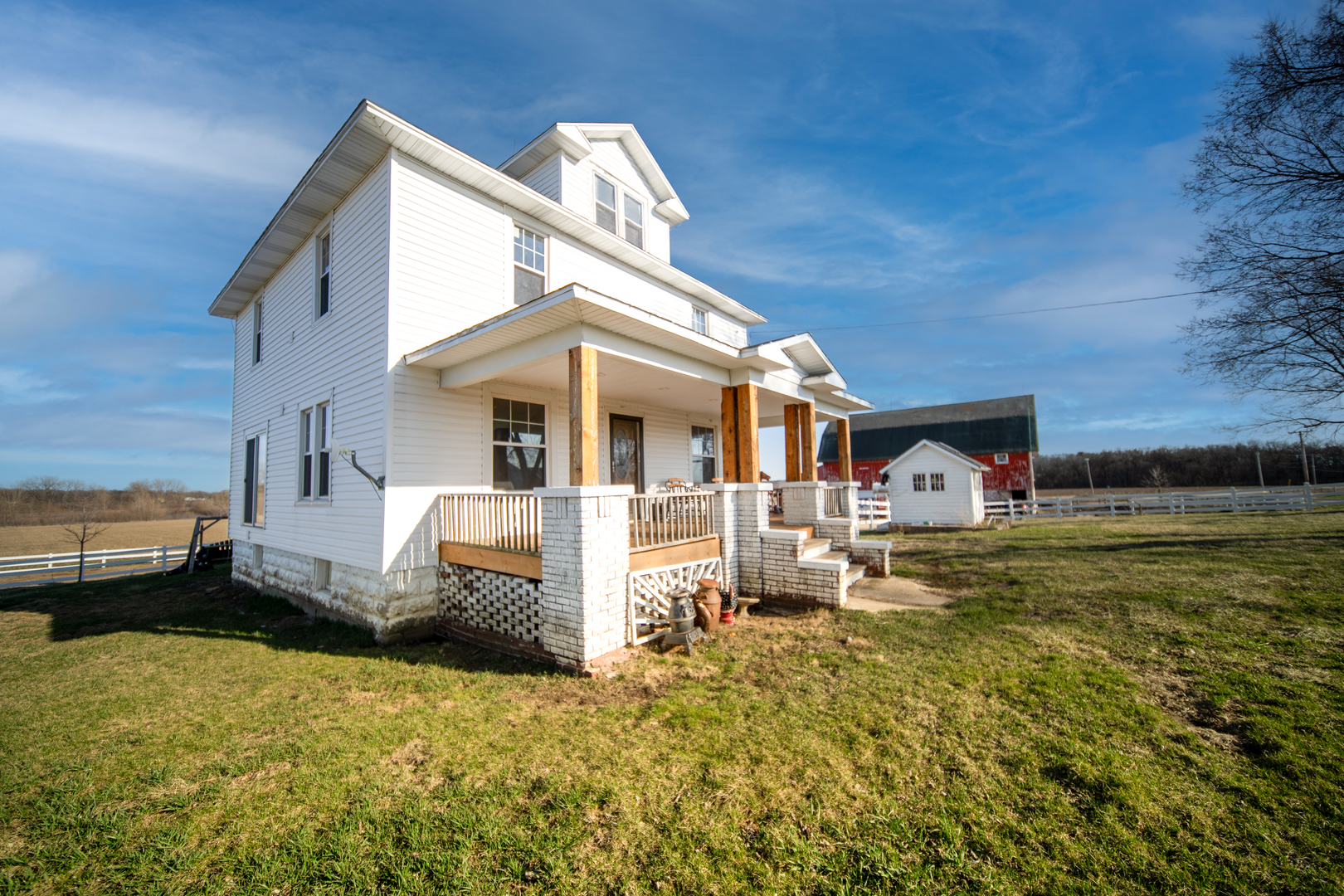 1801 Lee Center Road Amboy, IL 61310 - Photo 32 of 45 a front view of a house with a yard