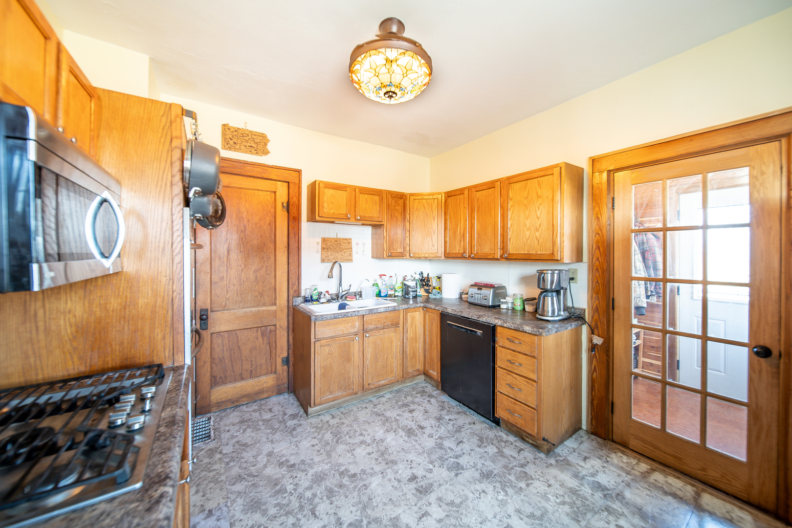 1801 Lee Center Road Amboy, IL 61310 - Photo 5 of 45 a kitchen with stainless steel appliances granite countertop a stove a sink and a refrigerator