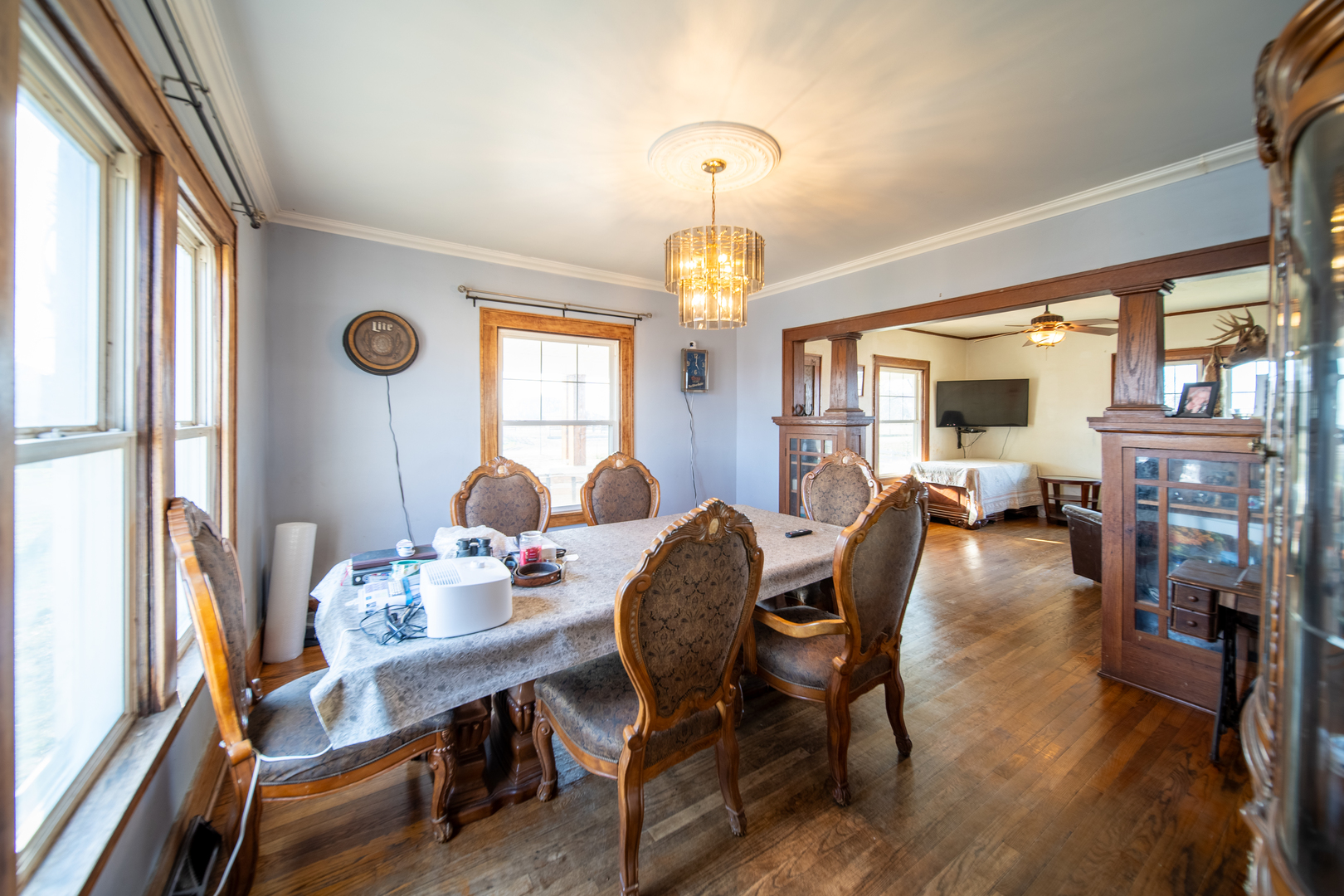 1801 Lee Center Road Amboy, IL 61310 - Photo 8 of 45 a dining room with furniture a chandelier and wooden floor